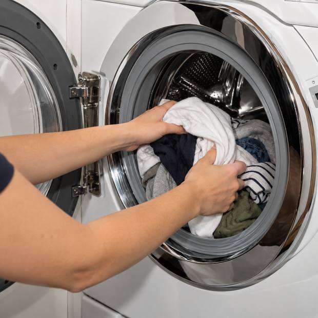 Loading laundry into the drum